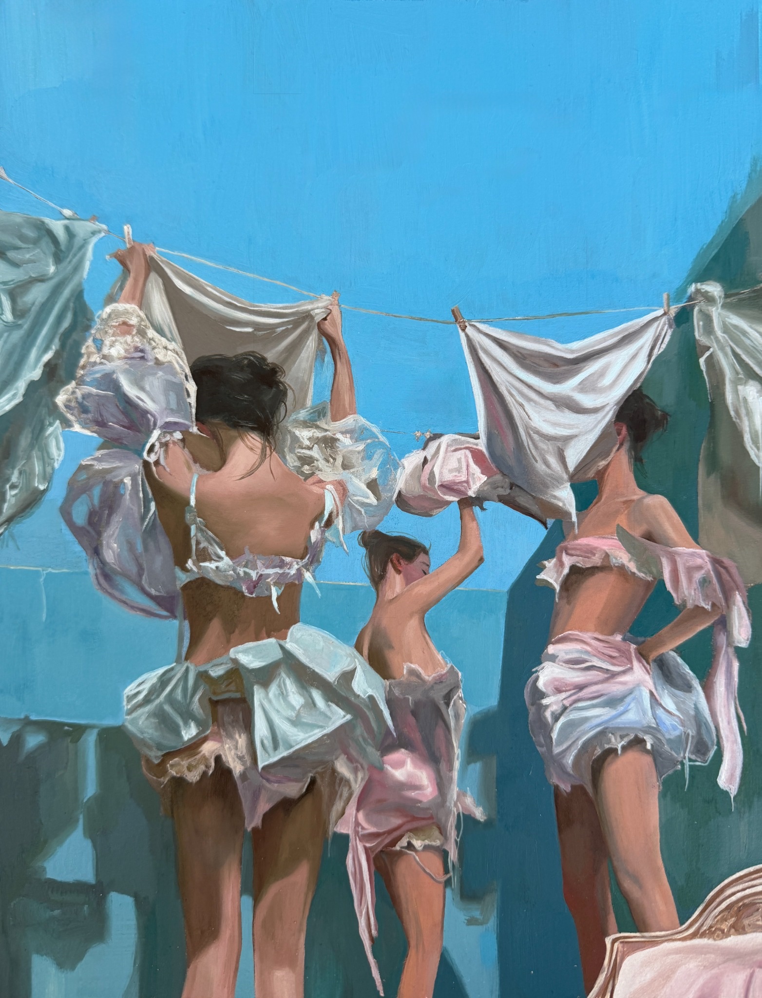 Four figures surrounded by pale garments hanging from clotheslines against a blue sky