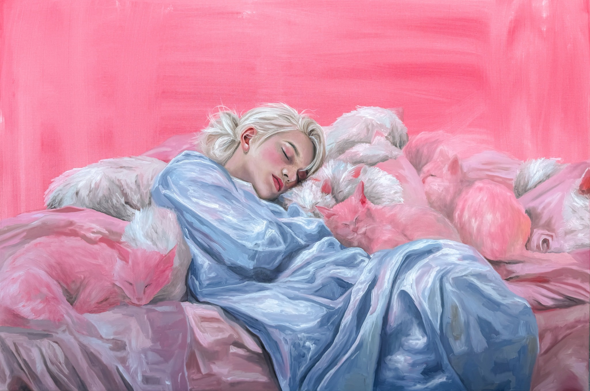 A sleeping figure in blue resting among a group of pink and white cats
